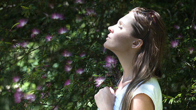 photo of a woman breathing outside