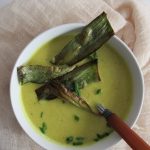 bowl of cauliflower leek soup with leek crisps