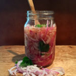gingery pickled onions in a glass jar