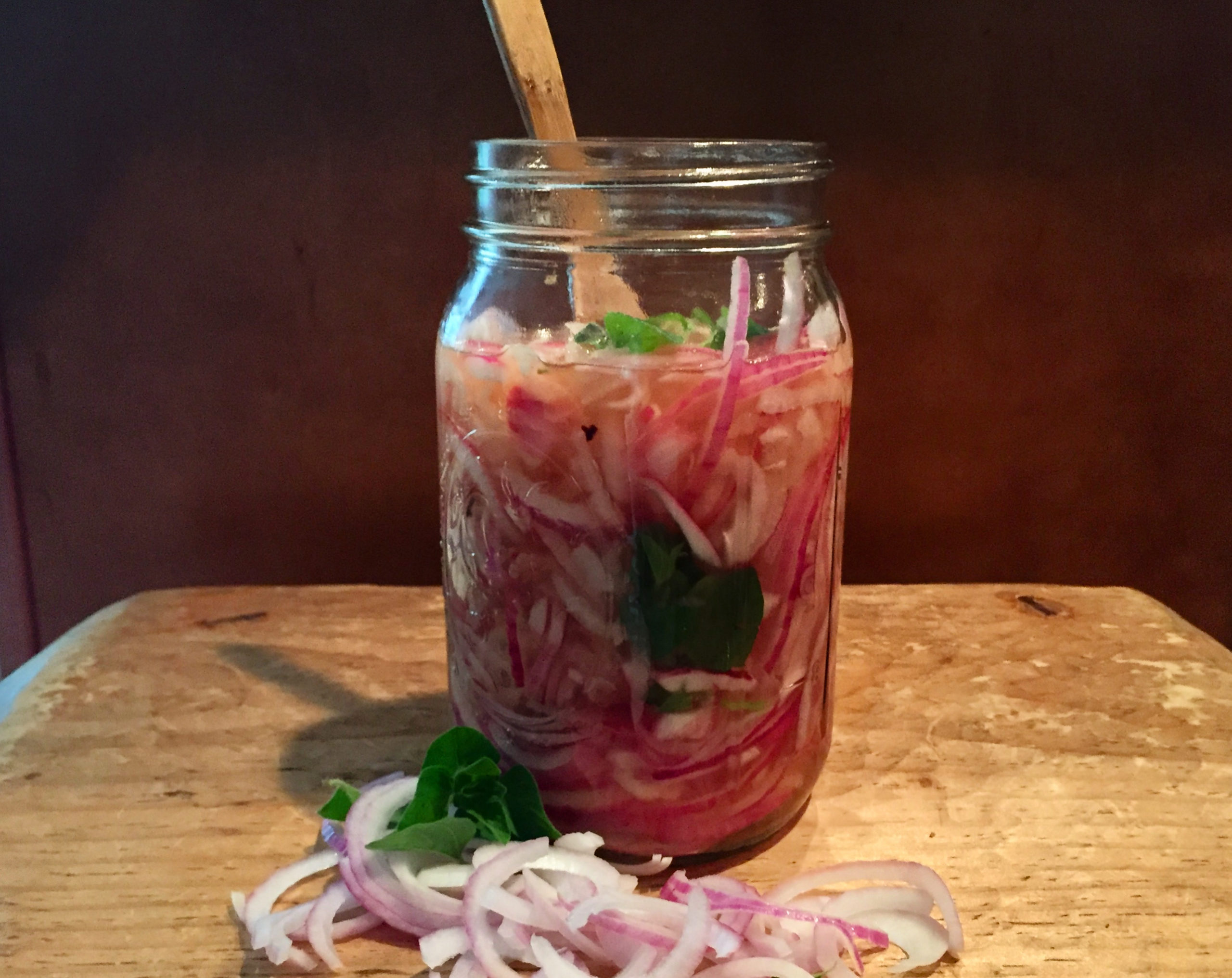 gingery pickled onions in a glass jar